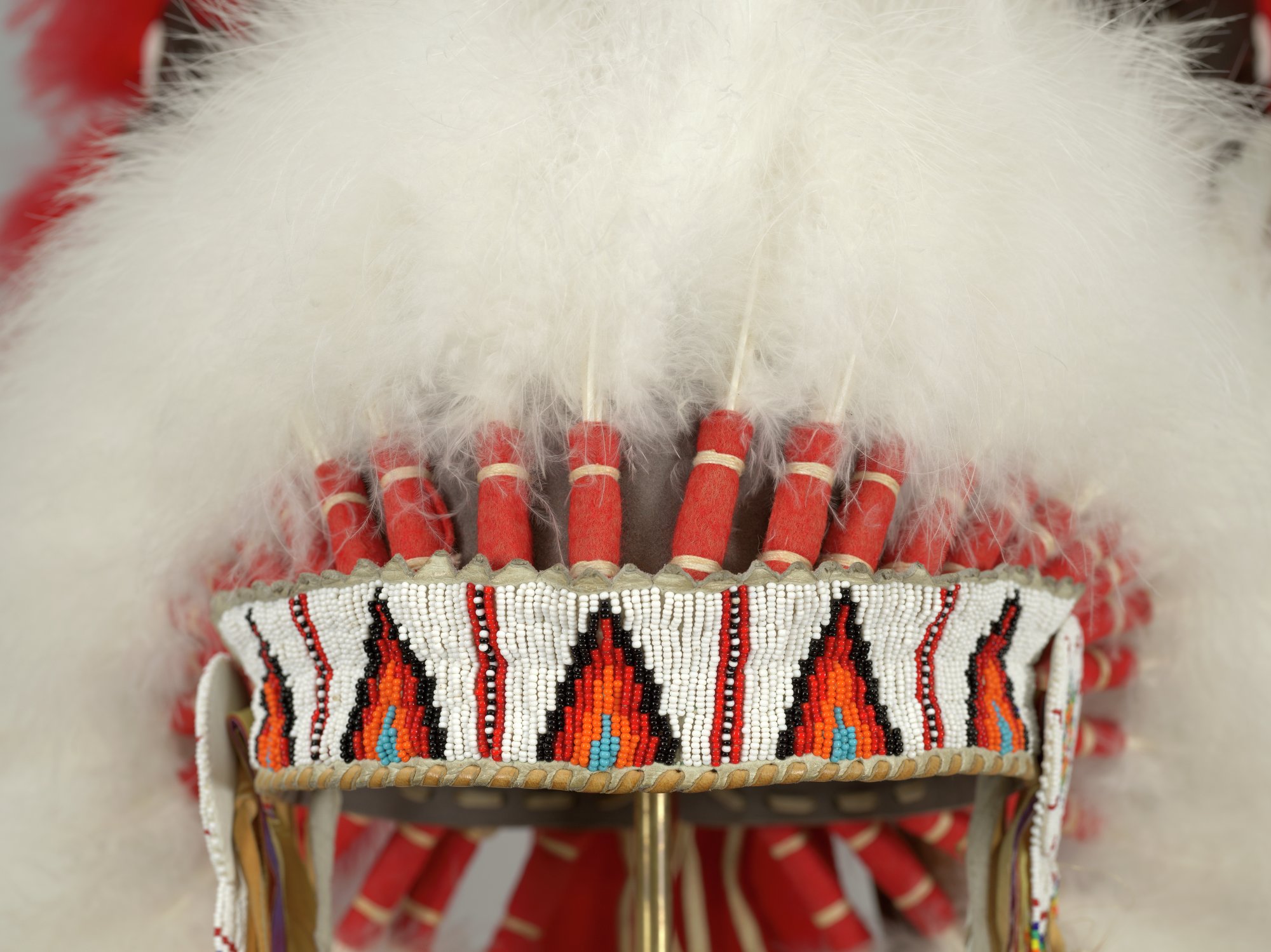 Eagle feathered headdress with ermine strips and beaded headband